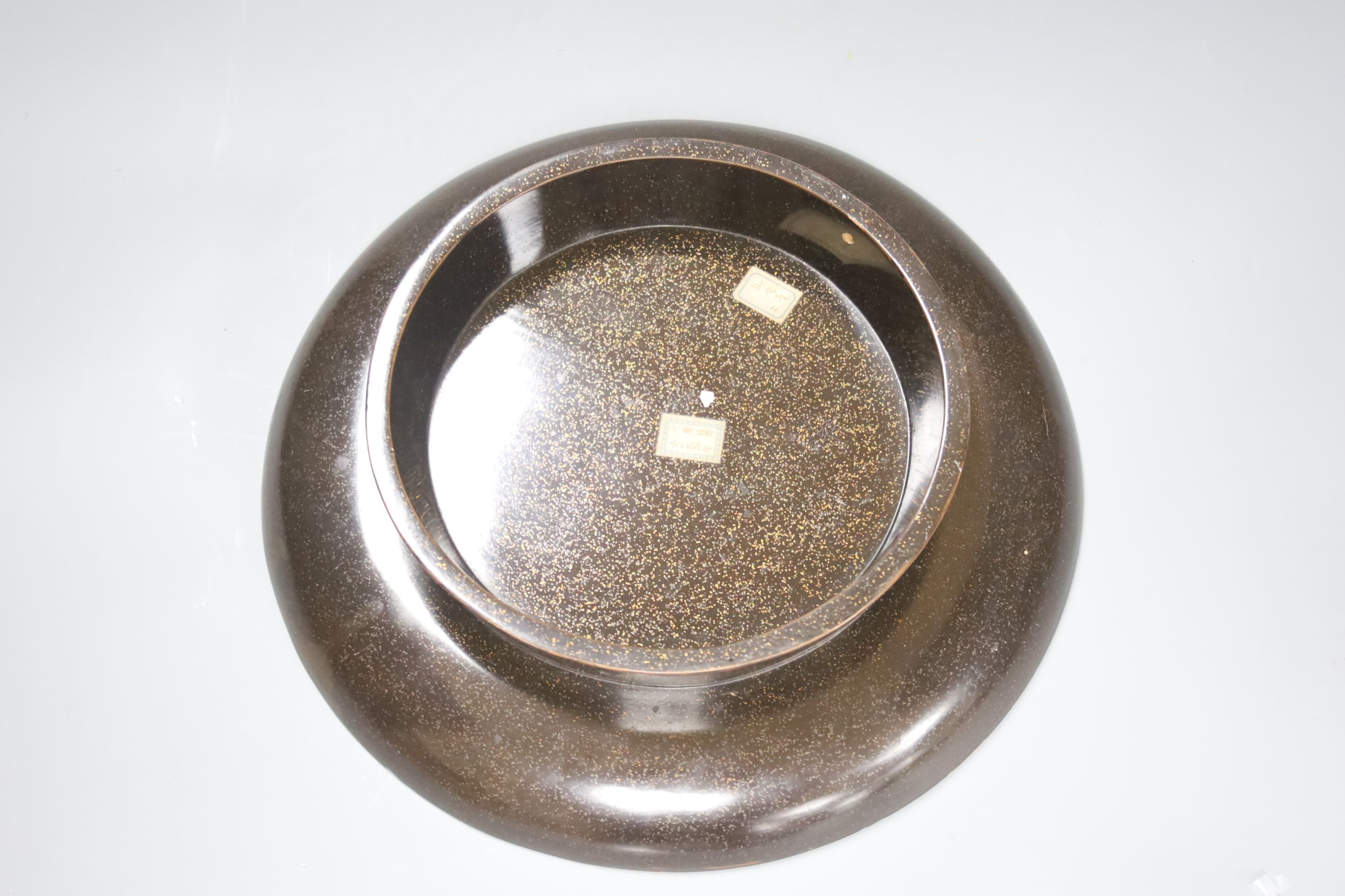 A Japanese Arita dish together with a similar ivory and mother of pearl mounted lacquer dish, diameter 30cm